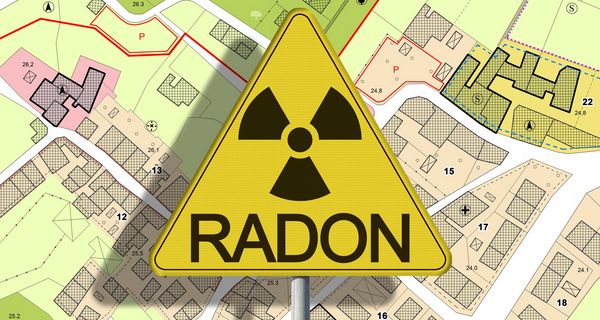 Ein Radon-Warnschild auf einer Karte mit Häusern.